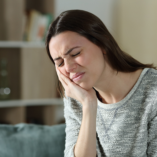 Image of a dental implant Signs and Symptoms of TMJ and TMD
